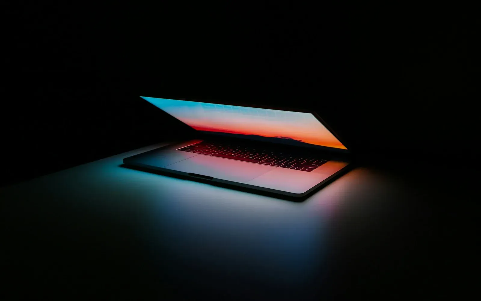 Laptop showing a CI pipeline deploying a full-stack app