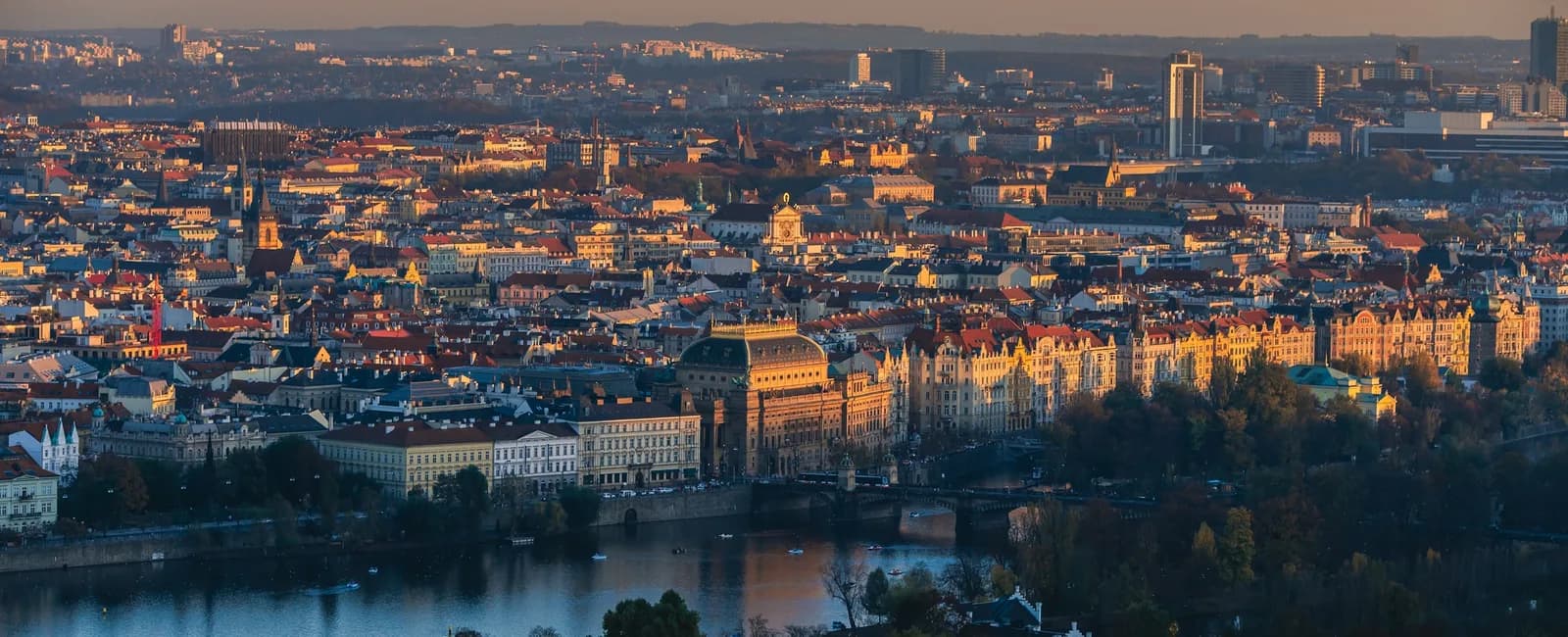 Prague skyline at sunset representing local businesses choosing between website platforms
